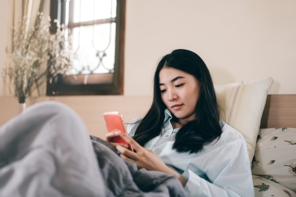 A woman holding a phone