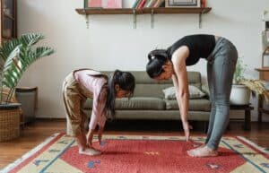 Mom and daughter stretching